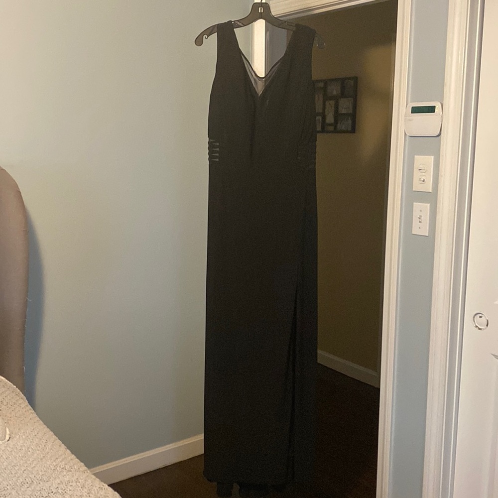 Gorgeous black long dress with peekaboo v neck and sides and leg slit